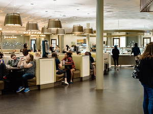 Students sit at booths in the Blanchard Dining Commons.