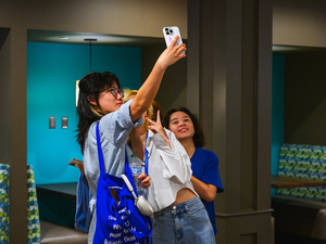 Students pose for selfie.