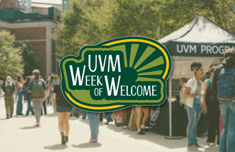 Students line up outside of the coffee tent last august at the Davis Center. The 2026 Week of Welcome logo appears in front of them. 