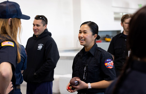 Photo of Aims student speaking with a recruiter at the Spring Fire/EMS Recruitment event.