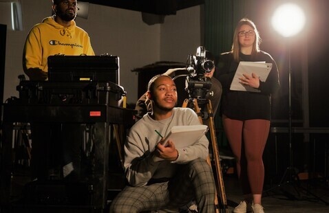 students in a filming class with equipment
