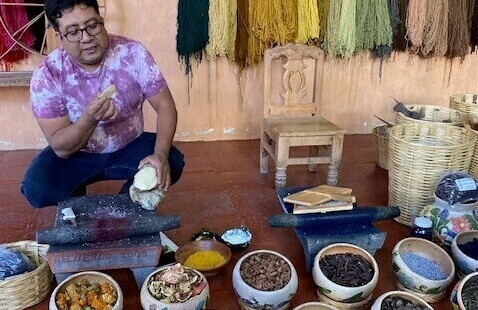 Man in mexico selling local spices in various pots