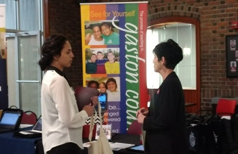 Two people talking in the Cromer Center 