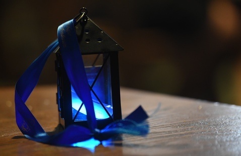 A single lit lantern on a table