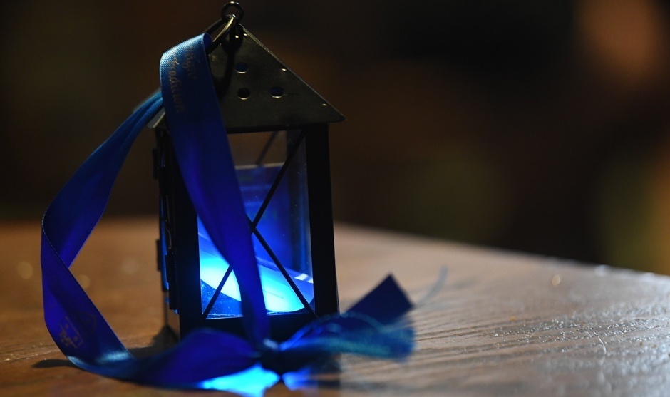 A single lit lantern on a table