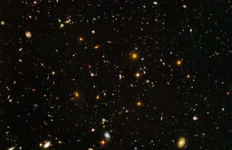 The hubble ultra deep field image from 2004. It shows thousands of galaxy clusters in various stages of development.