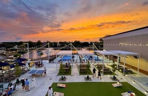 Cornhole boards and ping pong tables at Smash Park