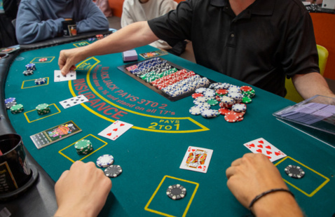 Students playing blackjack at casino night 2025.