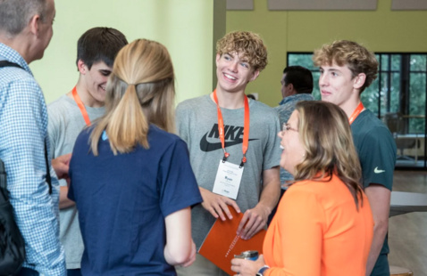 Hope Admissions staff converse with prospective students and their family.