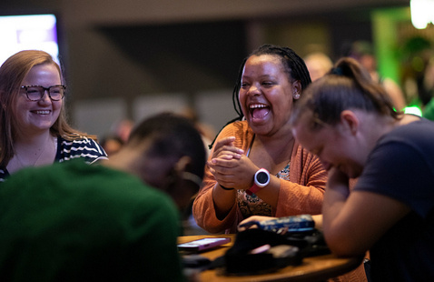Students laughing in the Syndicate