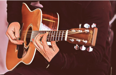 Cartoon of a person playing the guitar.