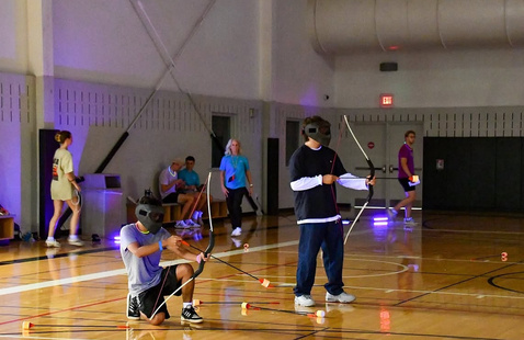 People playing archery tag 