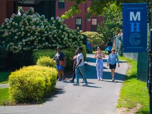 Students walk across MHC campus.