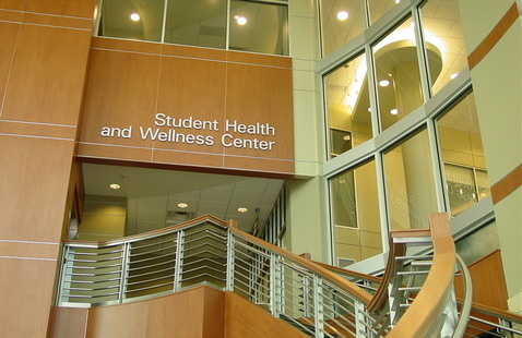 Staircase leading to the clinic with a sign that says, "Student Health and Wellness Center."