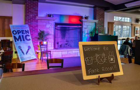 A photo of a coffeehouse with a welcome sign