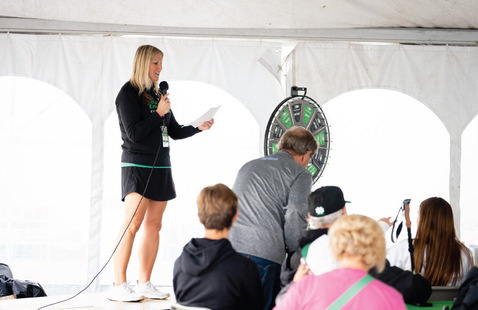Tailgate tent speaker addressing crowd