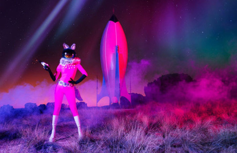 Person dressed in pink with a pink rocket 