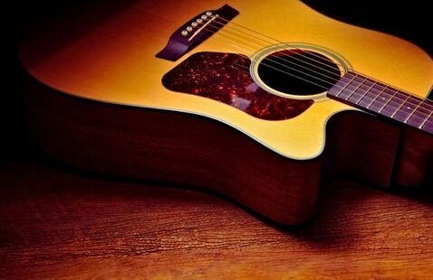 Guitar in a dark room