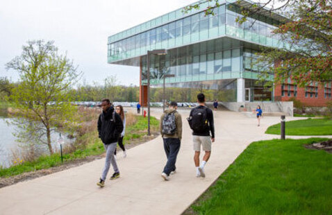 Students walking to class near the Lee Center at Oakton College's Des Plaines campus in the fall.