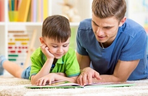 father reading with son
