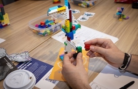 Hands building lego creation