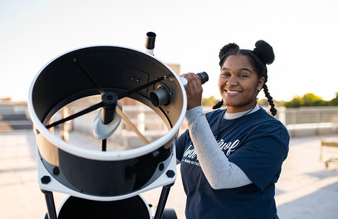 Student with telescope
