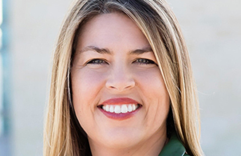 A professional portrait image of Dr. Erica Saphire.