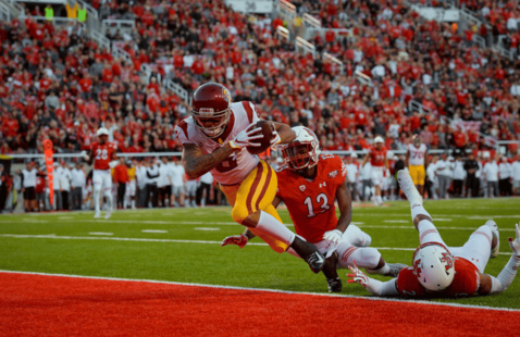 USC football player running across the field