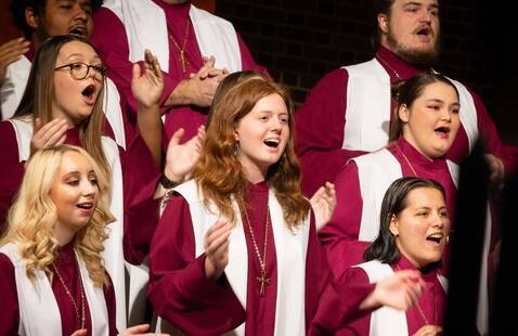 Students perform on stage during LR Christmas in Grace Chapel