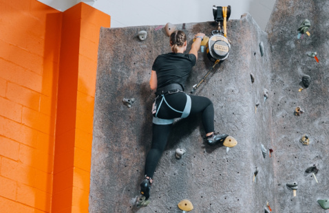 student on the climbing wall 