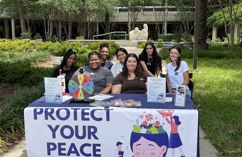Interns with Student Health Services tabling and providing peer education