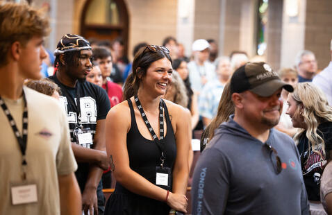 Students and parents gather in audience during admission event