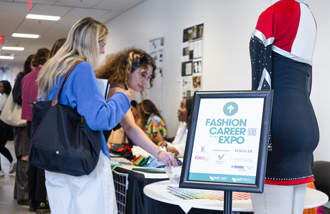 Students talk to Fashion Design vendors during the Fashion Career Expo