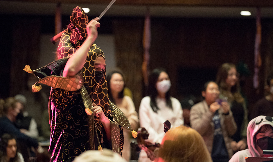 A photograph from a previous Monsters Ball performance. The conductor is seen wearing a full costume.