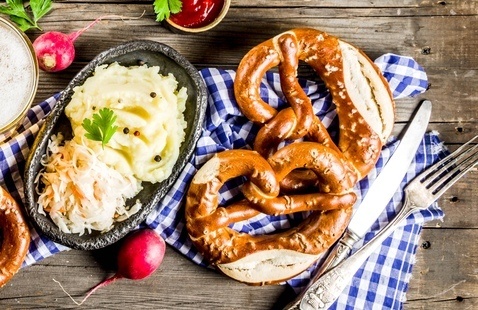 A meal including pretzels and mashed potatoes