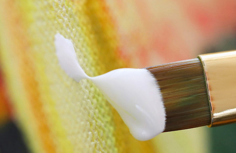 paintbrush with white paint