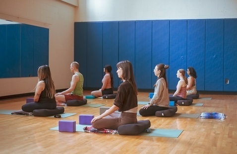 Students practicing yoga in the GAC