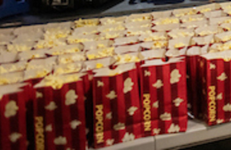 Many bags of popcorn on a table