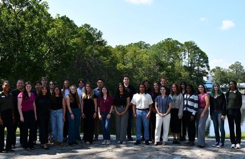 Student group standing outside for photo