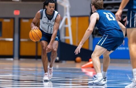 Two male players on the basketball court