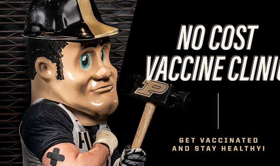 Purdue Pete with a bandage on his upper arm while holding his large hammer