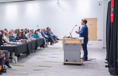 A person standing at a podium