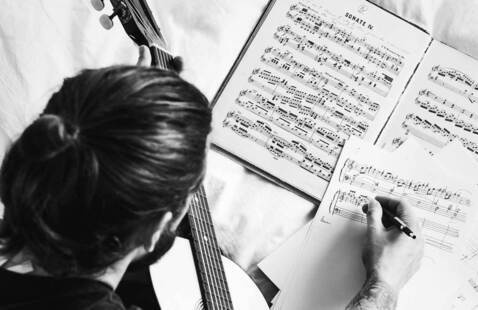 Overhead shot of person writing music