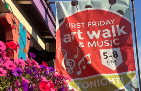FIRST FRIDAY art walk & MUSIC 5-8 PM TONIGHT! COMMUNITY TRADITION, hanging banner beside bright pink petunias along street