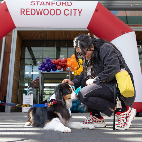 Therapy dog and employee at 2025 Wellness Fair