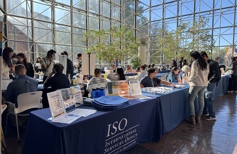 students visiting tables at resource fair.
