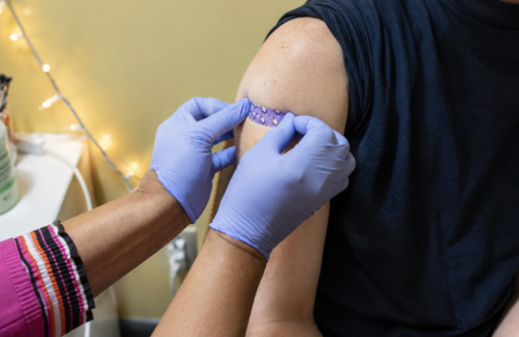 Person getting a band aid.