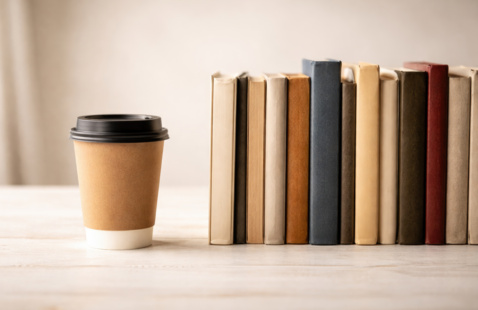 coffee cup and books