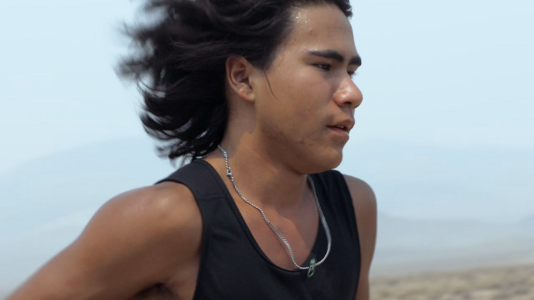 Photo of Ku Stevens running in Nevada desert