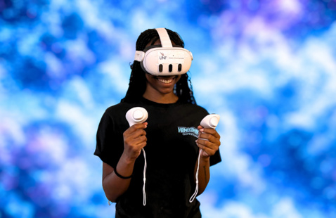 Woman explores virtual reality with a galaxy background behind her.